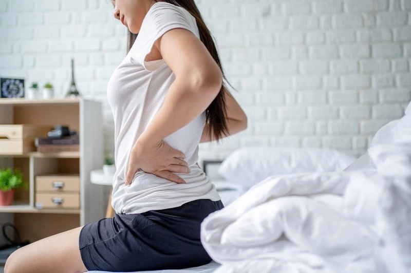 Bầu 3 tháng đầu đau lưng có sao không